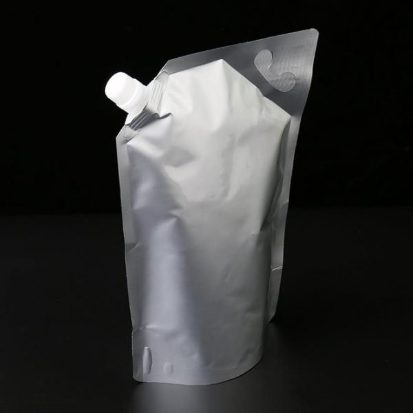 Spouted stand up barrier pouches